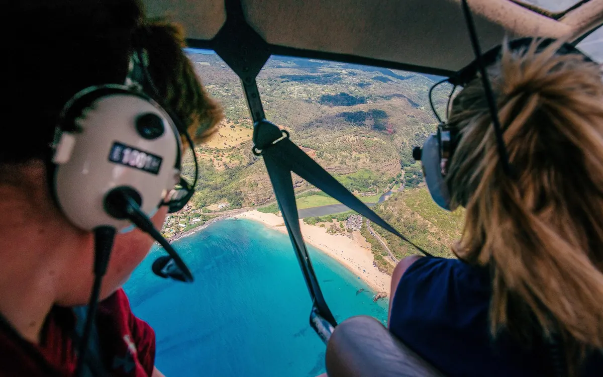 The view from a helicopter cockpit over the Oahu coastline