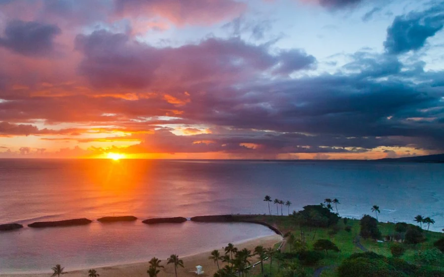 Sunset over the ocean off Waikiki seen from a helicopter