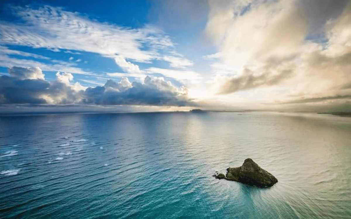 Sunset over the ocean off Waikiki seen from a helicopter